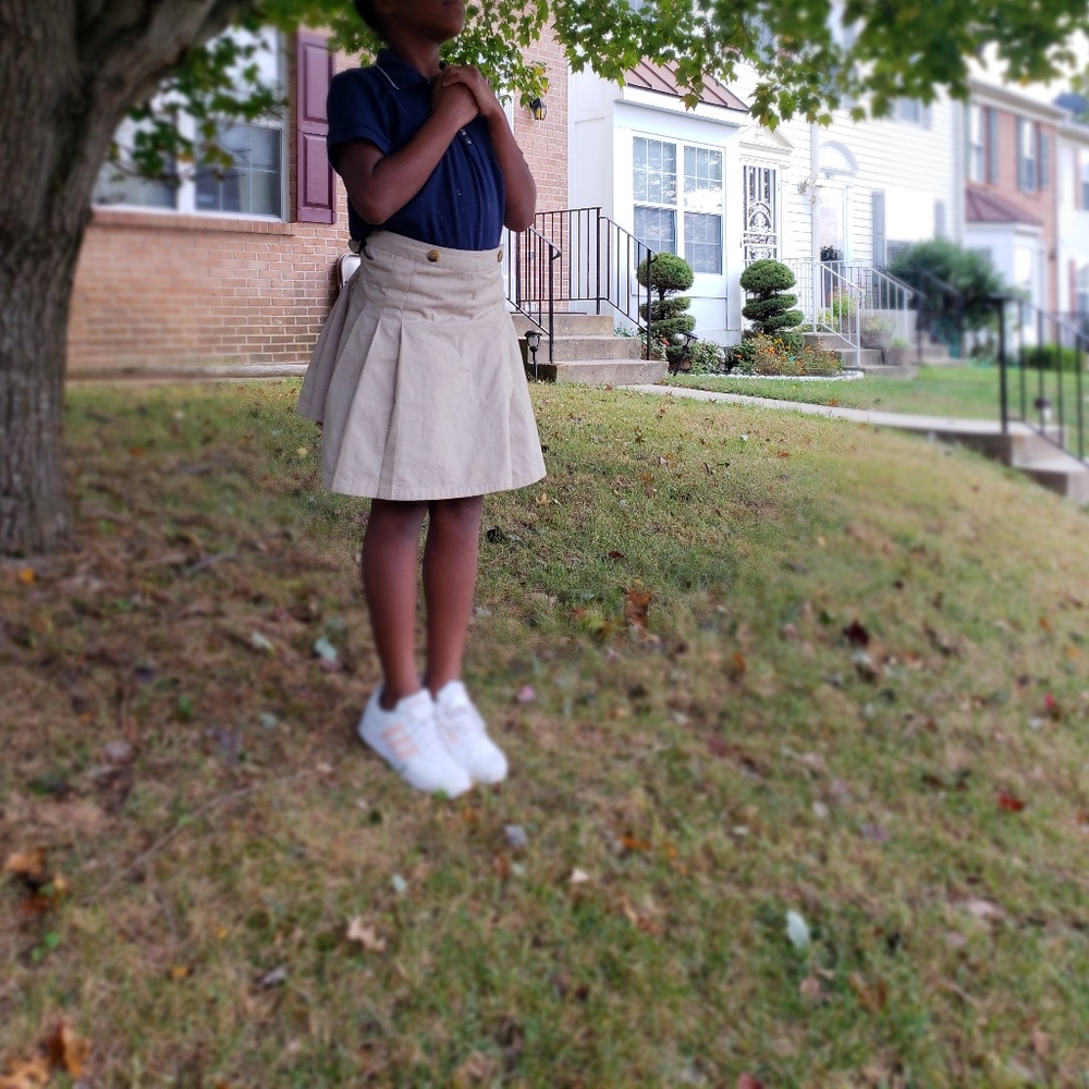 khaki skirt and polo dark blue shirt